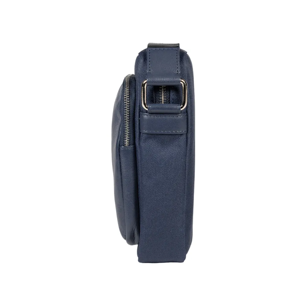 RB2002D | Nylon/Genuine Leather Shoulder Bag, with light grain. Zip closure and adjustable shoulder strap - Color Blue - Dimensions: cm 15.5 x 21 x 7. Packaging: Non-woven fabric bag